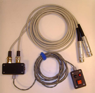 Figure 9 Custom switch unit built to operate two fluoroscopes simultaneously with a single input from the operator. Red and black buttons toggle high and low radiation dosage, respectively.