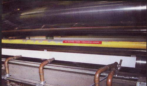 Pressurex® sensor film is placed on the roller at Mohawk Fine Papers before closing the nip. 