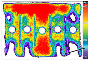 Figure 1: The clamping pressure used to bond Futek's metal foil strain gauge to the transducer body was not initially uniform, as veri¬fied by Pressurex film.