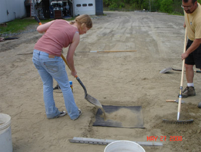 Figure C2. Placement of sifted sand over pressure pad, 27 May 2008.