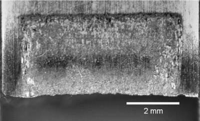 Fig. 13. Fretting scar for specimen 05-952 showing typical partial slip fretting scar.